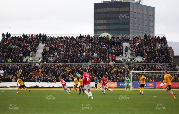 200124 - Newport County v Wrexham, EFL Sky Bet Championship - Fans in the temporary stand erected for the Manchester United FA Cup match watch the match