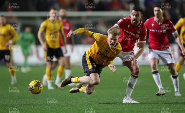 200124 - Newport County v Wrexham, EFL Sky Bet Championship - Will Evans of Newport County is brought down by Eoghan O'Connell of Wrexham