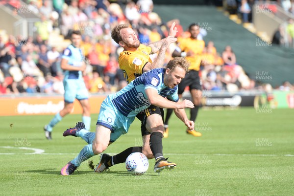 090917 - Newport County v Wycombe Wanderers - SkyBet League 2 - Sean Rigg of Newport County is tackled by Craig Mackail-Smith of Wycombe Wanderers