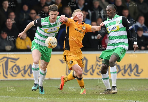 140417 - Newport County v Yeovil Town, Sky Bet League 2 - Alex Samuel of Newport County takes on Alex Lacey of Yeovil and Nathan Smith of Yeovil