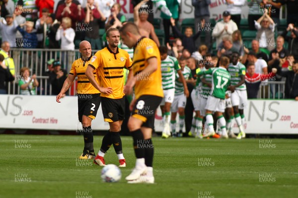 150918 Newport County v Yeovil Town - Sky Bet League 2 -  David Pipe(2) and Fraser Franks look dejected as players of Yeovil Town celebrate their third goal