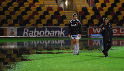 04.11.11 - Newport-Gwent Dragons v Cardiff Blues - RaboDirect PRO12 - Michael Paterson and Cardiff Blues coach Gareth Baber on the water logged pitch at Rodney Parade. 