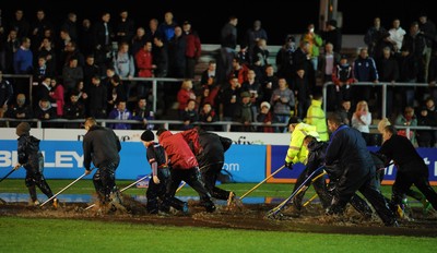 04.11.11 - Newport-Gwent Dragons v Cardiff Blues - RaboDirect PRO12 - Fans looks on as officials try to clear the water logged pitch at Rodney Parade. 