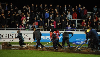 04.11.11 - Newport-Gwent Dragons v Cardiff Blues - RaboDirect PRO12 - Fans looks on as officials try to clear the water logged pitch at Rodney Parade. 