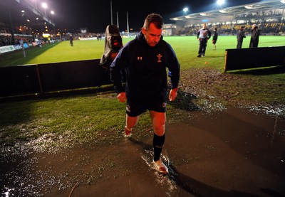 04.11.11 - Newport-Gwent Dragons v Cardiff Blues - RaboDirect PRO12 - Referee Nigel Owens leaves the water logged pitch at Rodney Parade after the game is postponed. 