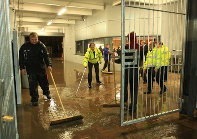 04.11.11 Dragons v Blues - RaboDirect PRO 12 - Ground staff attempt to clear rain water before kick off 