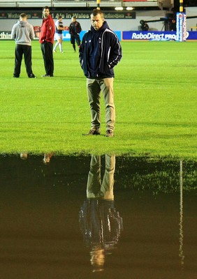 04.11.11 Dragons v Blues - RaboDirect PRO 12 - referee Nigel Owens conducts a pitch inspection 