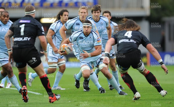 150912 - Newport-Gwent Dragons v Cardiff Blues - RaboDirect PRO12 -Andries Pretorius of Cardiff Blues takes Phil Price and Ian Nimmo of Newport-Gwent Dragons