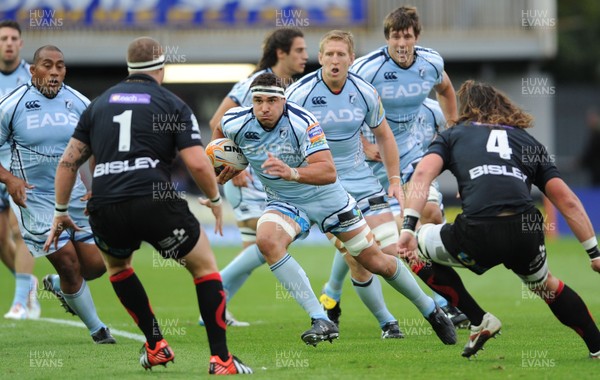 150912 - Newport-Gwent Dragons v Cardiff Blues - RaboDirect PRO12 -Andries Pretorius of Cardiff Blues takes Phil Price and Ian Nimmo of Newport-Gwent Dragons