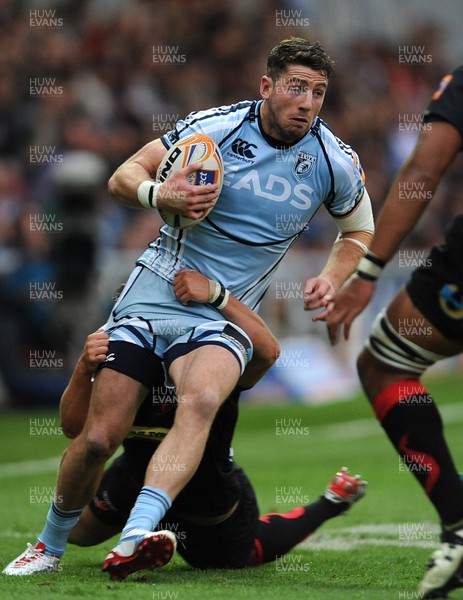 150912 - Newport-Gwent Dragons v Cardiff Blues - RaboDirect PRO12 -Alex Cuthbert of Cardiff Blues is tackled by Dan Evans of Newport-Gwent Dragons