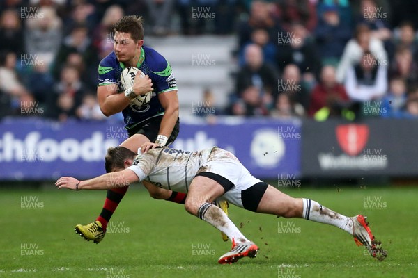 271215 - Newport Gwent Dragons v Cardiff Blues - Guinness PRO12 - Carl Meyer of Newport Gwent Dragons is tackled by Garyn Smith of Cardiff Blues