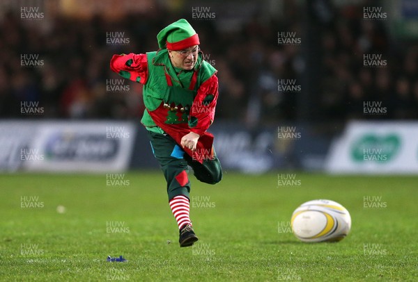 271215 - Newport Gwent Dragons v Cardiff Blues - Guinness PRO12 - A dwarf  dressed as a christmas elf kicks a penalty at half time