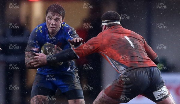 290117 - Newport Gwent Dragons v Newcastle Falcons - Anglo-Welsh Cup - Tyler Morgan of Newport Gwent Dragons is tackled by Rob Vickers of Newcastle