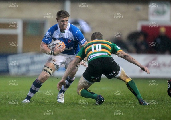 290814 - Newport Gwent Dragons v Northampton Saints - Pre Season - Andrew Coombs of Newport Gwent Dragons is tackled by Will Hooley of Northampton Saints 