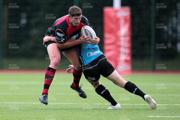 140815 - Newport Gwent Dragons v Nottingham - Pre Season Friendly - Ross Wardle of Newport Gwent Dragons is tackled by Billy Robinson of Notthingham