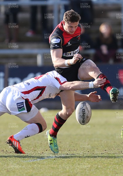 080315 - Newport Gwent Dragons v Ulster, Guinness PRO12 - Dragons' Hallam Amos kicks ahead as Ulster's Darren Cave tackles