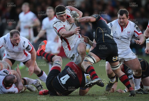 080315 - Newport Gwent Dragons v Ulster, Guinness PRO12 - Ulster's Rob Herring is tackled by Dragons' James Benjamin and Dragons' Andrew Coombs