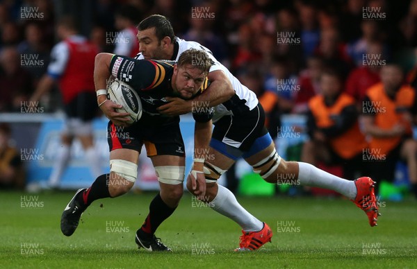 090916 - Newport Gwent Dragons v Zebre - Guinness PRO12 - Lewis Evans of Newport Gwent Dragons is tackled by Quintin Geldenhuys of Zebre