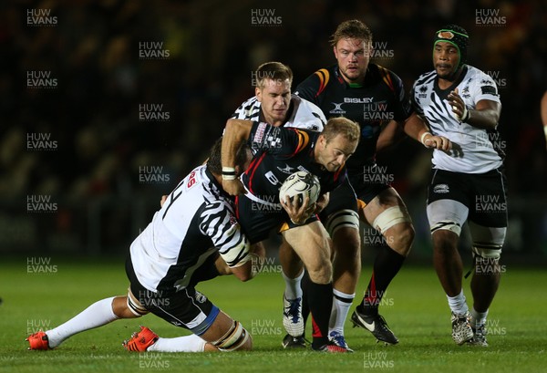 090916 - Newport Gwent Dragons v Zebre - Guinness PRO12 - Sarel Pretorius of Newport Gwent Dragons is tackled by Quintin Geldenhuys of Zebre