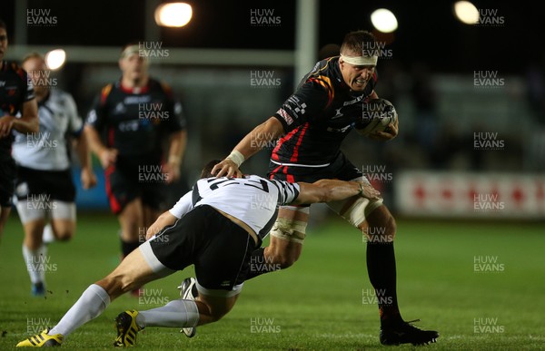 090916 - Newport Gwent Dragons v Zebre - Guinness PRO12 - Ed Jackson of Newport Gwent Dragons is tackled by Edoardo Padovani of Zebre