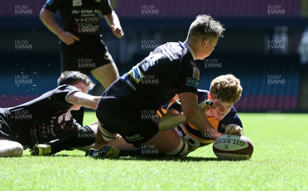 230416 - WRU - Bowl Final - Burry Port v Newport HSOB - Joshua Ford of Newport pushes over the line to score a try