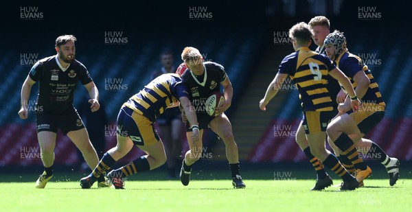 230416 - WRU - Bowl Final - Burry Port v Newport HSOB - Daniel Green of Burry Port is tackled by Josh Wall of Newport