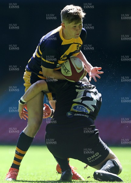 230416 - WRU - Bowl Final - Burry Port v Newport HSOB - Fraser Stroud of Newport is tackled by Daniel Dawkins of Burry Port