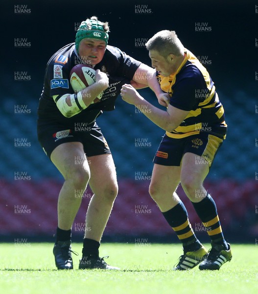 230416 - WRU - Bowl Final - Burry Port v Newport HSOB - Archie Davies is tackled by Rhys Hunt of Newport