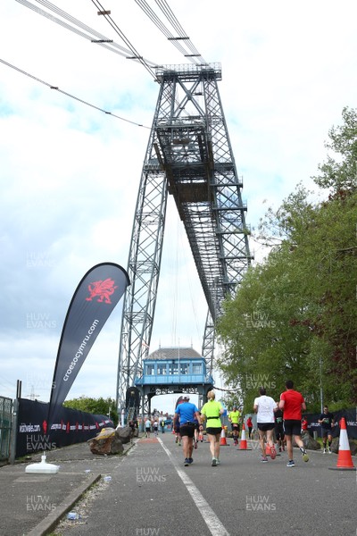 050519 - Newport Wales  Marathon and 10K - Runners in The Newport Marathon pass the 24 mile marker at The Transporter Bridge 