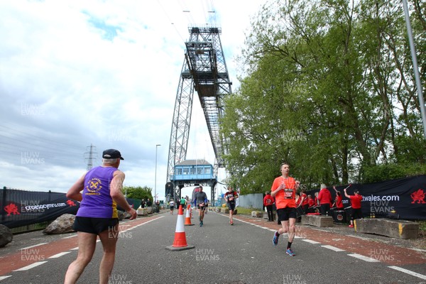 050519 - Newport Wales  Marathon and 10K - Runners in The Newport Marathon pass the 24 mile marker at The Transporter Bridge 