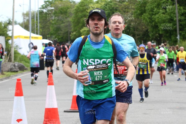 050519 - Newport Wales  Marathon and 10K - Runner for NSPCC in The Newport Marathon passes the 24 mile marker at The Transporter Bridge 