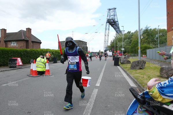 050519 - Newport Wales  Marathon and 10K - Runner for Cancer Research UK in The Newport Marathon passes the 24 mile marker at The Transporter Bridge 