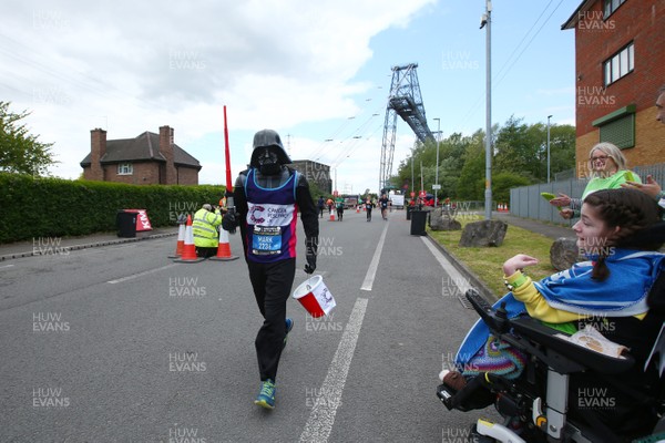 050519 - Newport Wales  Marathon and 10K - Runner for Cancer Research UK in The Newport Marathon passes the 24 mile marker at The Transporter Bridge 