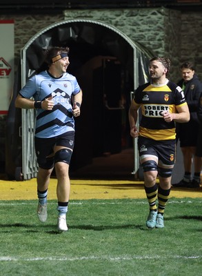 211125 - Newport RFC v Cardiff RFC, Super Rugbi Cymru - Sean Moore of Cardiff and Ben Roach of Newport lead the teams out as they both mark 100 appearances for their clubs