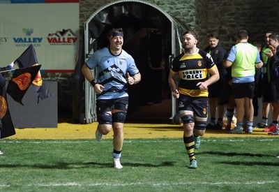 211125 - Newport RFC v Cardiff RFC, Super Rugbi Cymru - Sean Moore of Cardiff and Ben Roach of Newport lead the teams out as they both mark 100 appearances for their clubs