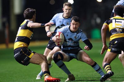 211125 - Newport RFC v Cardiff RFC, Super Rugbi Cymru - Joe Goodchild of Cardiff takes on Iestyn Galton of Newport