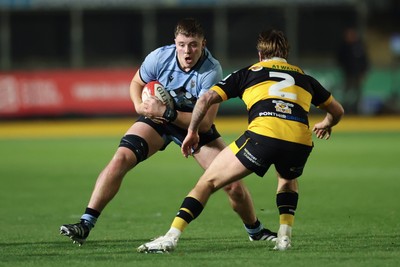 211125 - Newport RFC v Cardiff RFC, Super Rugbi Cymru - Evan Rees of Cardiff takes on Wade Langley of Newport