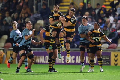 211125 - Newport RFC v Cardiff RFC, Super Rugbi Cymru - Ben Roach of Newport and Ioan Rhys Davies of Newport make sure of possession
