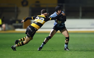 211125 - Newport RFC v Cardiff RFC, Super Rugbi Cymru - Rhys Cummings of Cardiff takes on Morgan Williams of Newport