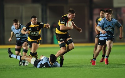211125 - Newport RFC v Cardiff RFC, Super Rugbi Cymru - Barny Langton-Cryer of Newport is tackled