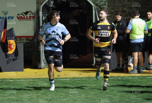 211125 - Newport RFC v Cardiff RFC, Super Rugbi Cymru - Sean Moore of Cardiff and Ben Roach of Newport lead the teams out as they both mark 100 appearances for their clubs