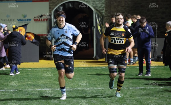 211125 - Newport RFC v Cardiff RFC, Super Rugbi Cymru - Sean Moore of Cardiff and Ben Roach of Newport lead the teams out as they both mark 100 appearances for their clubs