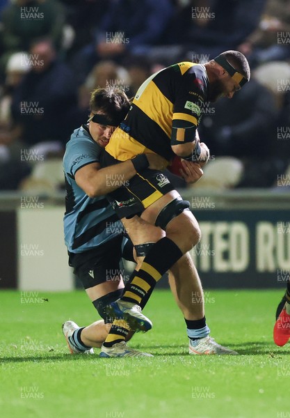 211125 - Newport RFC v Cardiff RFC, Super Rugbi Cymru - Josh Skinner of Newport is held by Sean Moore of Cardiff