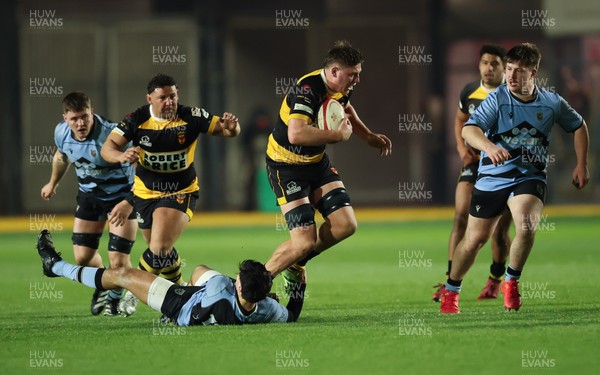 211125 - Newport RFC v Cardiff RFC, Super Rugbi Cymru - Barny Langton-Cryer of Newport is tackled
