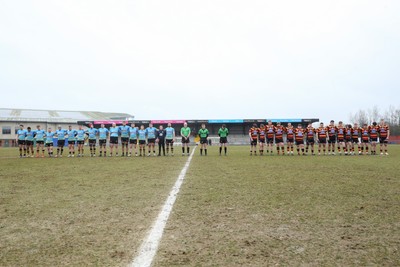 150225 - Newport RFC v Carmarthen Quins - Super Rygbi Cymru (SRC) - Players of Newport and Caramarthen Quins pay their respects before kick off