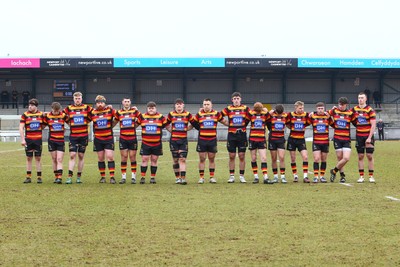 150225 - Newport RFC v Carmarthen Quins - Super Rygbi Cymru (SRC) - Players of Newport and Caramarthen Quins pay their respects before kick off