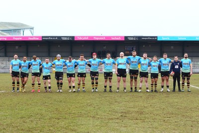 150225 - Newport RFC v Carmarthen Quins - Super Rygbi Cymru (SRC) - Players of Newport and Caramarthen Quins pay their respects before kick off