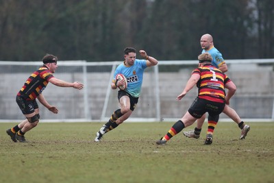 150225 - Newport RFC v Carmarthen Quins - Super Rygbi Cymru (SRC) - Jac Lloyd of Newport takes on Tom Curry(L) and Keanu Evans of Carmarthen