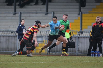 150225 - Newport RFC v Carmarthen Quins - Super Rygbi Cymru (SRC) - Ashton Hewitt of Newport takes on Iestyn Wood of Carmarthen