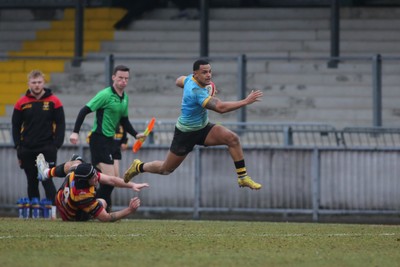 150225 - Newport RFC v Carmarthen Quins - Super Rygbi Cymru (SRC) - Ashton Hewitt of Newport takes on Iestyn Wood of Carmarthen